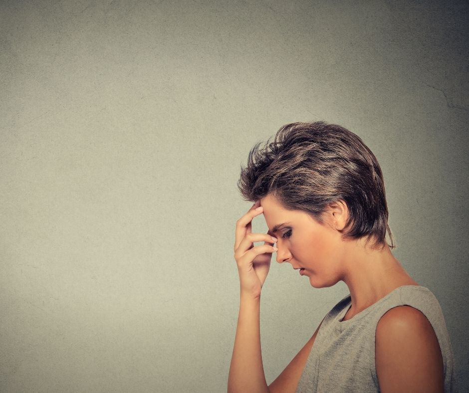 Person thinking representing aphantasia, where a person cannot create mental images, and how hypnotherapy can be adapted without visualisation.